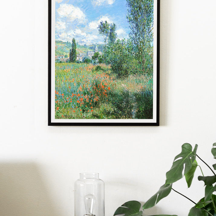 Claude Monet exhibition poster, featuring his painting 'View of Vétheuil' from 1897.